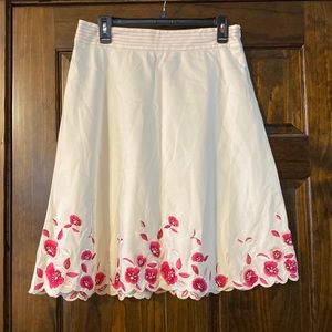 Women’s spring skirt white with pink floral details on hem. Size 8.